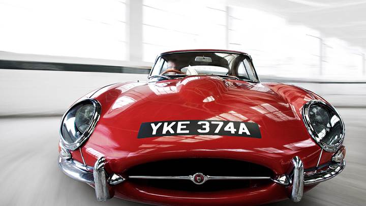 Running Front Pose Of Jaguar E Type Coupe In Red
